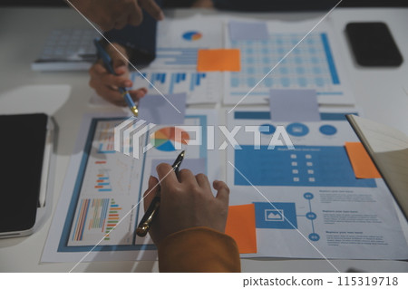 Business team collaboration discussing working analyzing with financial data and marketing growth report graph in team, presentation and brainstorming to strategy planning making profit of company. 115319718