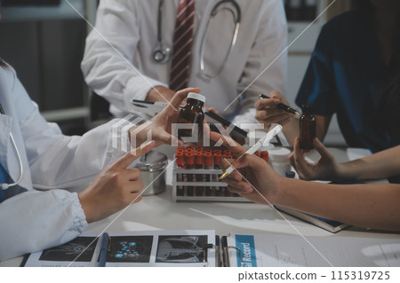 Group of professional medical doctor team meeting training medical in uniform working discussing and talk with patients record, teaching medic team, sit in hospital.health medical care concept Group of professional medical doctor team meeting training medical in uniform working discussing and talk with patients record, teaching medic team, sit in hospital.health medical care concept 115319725