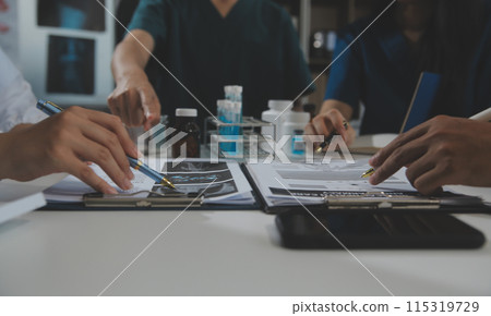 Group of professional medical doctor team meeting training medical in uniform working discussing and talk with patients record, teaching medic team, sit in hospital.health medical care concept 115319729