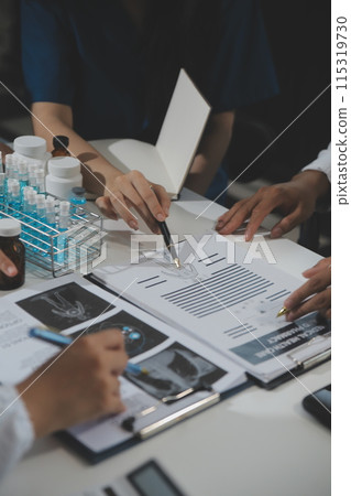 Group of professional medical doctor team meeting training medical in uniform working discussing and talk with patients record, teaching medic team, sit in hospital.health medical care concept 115319730