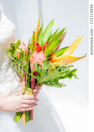 Bride holding wedding bouquet 115319856