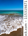Sea surf on the beach of Spain in spring. High quality photo 115319871