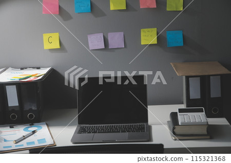 Studio workspace with laptop computer and office supplies. Work from home. With copy space Studio workspace with laptop computer and office supplies. Work from home. With copy space 115321368