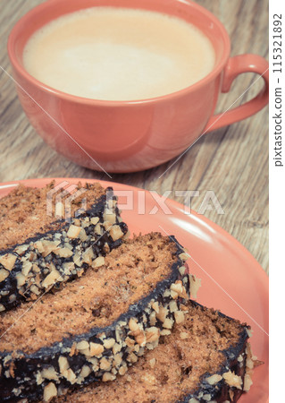Fresh baked pastry made of zucchini and cup of white coffee. Delicious dessert 115321892