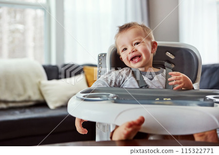Childhood, breakfast and feeding chair for toddler in the morning prepare to eat porridge. Hungry, baby boy or child ready to eat meal, lunch or dinner in family home, apartment or house with kitchen 115322771