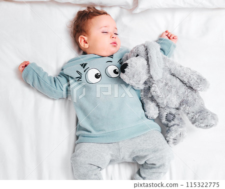 Relax, sleeping and baby with teddy bear on bed in top view house for resting, dream or afternoon nap. Child development, toy and calm boy kid in a bedroom for morning routine, peace and quiet snooze Relax, sleeping and baby with teddy bear on bed in top view house for resting, dream or afternoon nap. Child development, toy and calm boy kid in a bedroom for morning routine, peace and quiet snooze 115322775