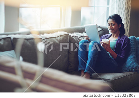 Woman, home and reading tablet for relax on sofa, scroll on internet or social media. Female person, mobile technology and living room with research and happiness, online blog or email communication Woman, home and reading tablet for relax on sofa, scroll on internet or social media. Female person, mobile technology and living room with research and happiness, online blog or email communication 115322802
