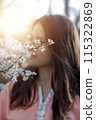 warm portrait of a sweet girl in the garden 115322869