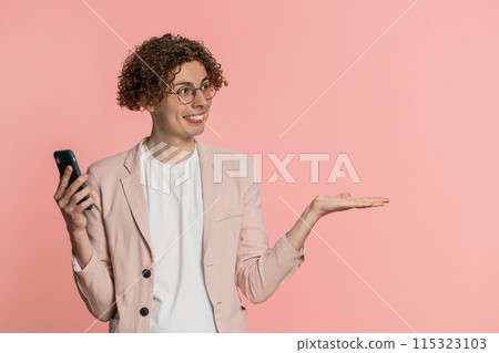 Man using smartphone showing pointing on phone, advertising web application, positive feedback Man using smartphone showing pointing on phone, advertising web application, positive feedback 115323103