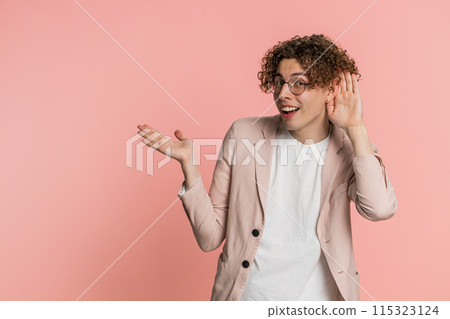 Caucasian man trying hear you looking confused and frowning, keeping arm near ear for louder voice Caucasian man trying hear you looking confused and frowning, keeping arm near ear for louder voice 115323124