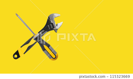 Vintage repair tools in a workshop. Wrench, hammer, and pliers for industrial construction and Vintage repair tools in a workshop. Wrench, hammer, and pliers for industrial construction and 115323669