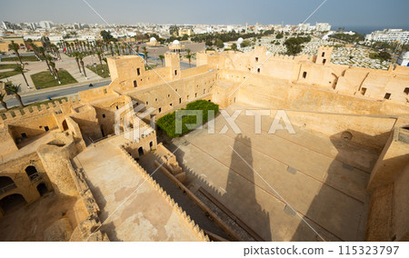 Monastir in Tunisia is an ancient city and popular tourist destination on Mediterranean Sea. Landscape view of main fortress of city 115323797