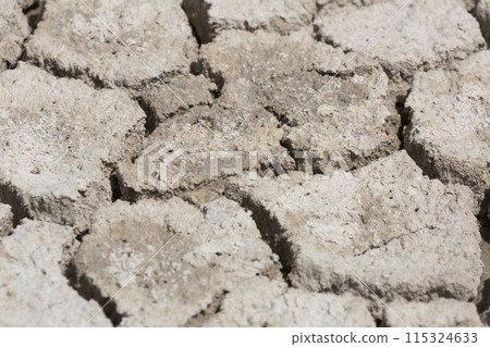 Cracked black ground 115324633