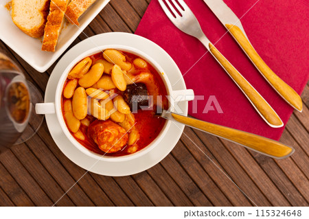 Beans stew with pork, blood sausage and chorizo 115324648