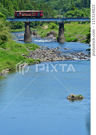 Nagaragawa Railway train crossing a bridge over the Nagaragawa River Nagaragawa Railway train crossing a bridge over the Nagaragawa River 115324822