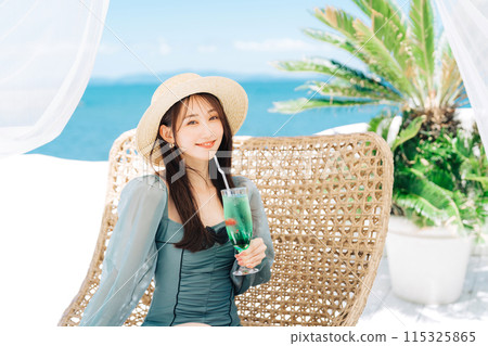 Young woman enjoying vacation at resort Young woman enjoying vacation at resort 115325865