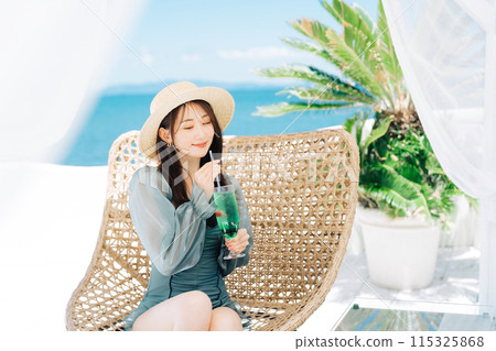 Young woman enjoying vacation at resort Young woman enjoying vacation at resort 115325868