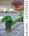 Original bench in the shape of a green dog 115325912