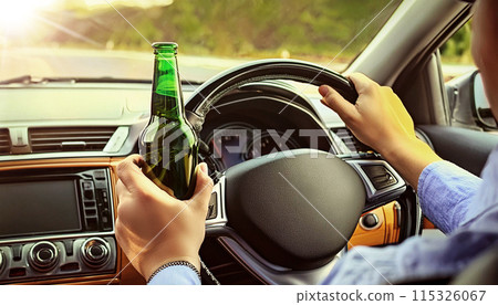 Close-up of a Man Drinking Beer While Driving a Car - Generative Ai Close-up of a Man Drinking Beer While Driving a Car - Generative Ai 115326067