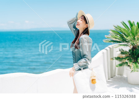 Young woman enjoying vacation at resort Young woman enjoying vacation at resort 115326388
