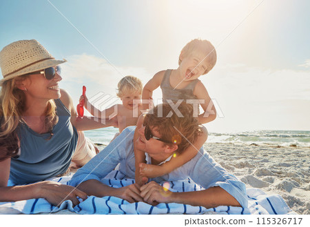 Woman, man and kids on beach as family on holiday, vacation in Istanbul for happiness or memory. Excited, people and ocean for relax, together and bonding as parents for growth, development and love 115326717