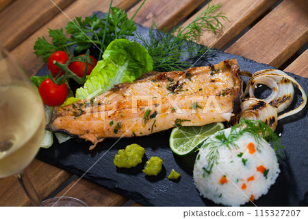 Roasted trout fillet with rice 115327207