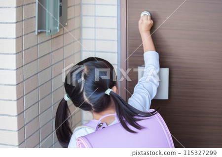 A child unlocking a house (kagikko) A child unlocking a house (kagikko) 115327299