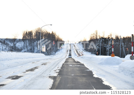 A snow-covered winter road A snow-covered winter road 115328123