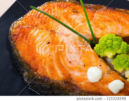 Roasted salmon steak with broccoli Roasted salmon steak with broccoli 115328599