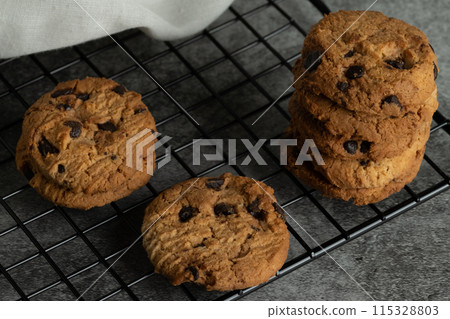 Freshly baked chocolate chip cookies. 115328803