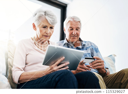 Tablet, mature couple and browsing with credit card in house for online shopping in living room. Subscription, movies and streaming with internet banking, digital purchase and transaction in home. 115329027
