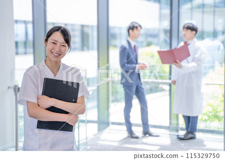 Smiling nurse holding a file 115329750
