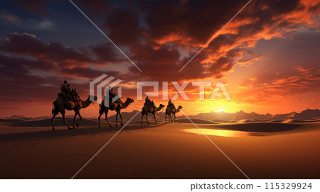 Camel caravan going through the desert at sunset. 115329924