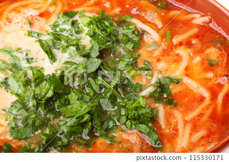 Tomato soup, parsley food texture background 115330171