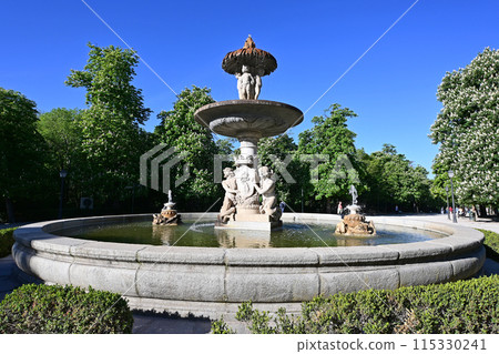 Beautiful fountain in El Retiro Park in Madrid, Spain on sunny April morning. 115330241