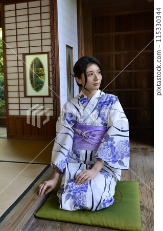 Portrait of a young woman wearing a yukata Portrait of a young woman wearing a yukata 115330344