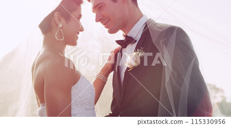 Couple, happy and wedding veil in outdoor, marriage and commitment at ceremony or care. People, romance and loyalty in relationship, partnership and trust in support or together for celebration 115330956
