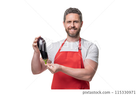 happy man in apron with eggplant vegetable isolated on white happy man in apron with eggplant vegetable isolated on white 115330971