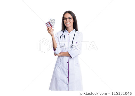 doctor with medication pill isolated on white background. doctor hold medication pill in studio. doctor with medication pill isolated on white background. doctor hold medication pill in studio. 115331046