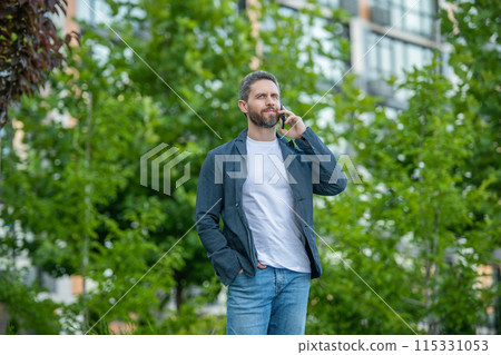 image of man call on smartphone and talk. man has smartphone call outdoor. image of man call on smartphone and talk. man has smartphone call outdoor. 115331053