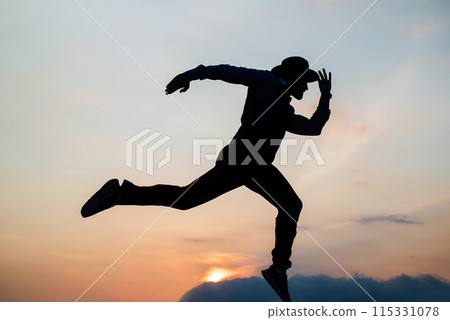 Let freedom ring. stamina and energy. need the inspiration. man feel motivation. challenge to himself. man runner silhouette on sky background. confidence and success. run to successful future Let freedom ring. stamina and energy. need the inspiration. man feel motivation. challenge to himself. man runner silhouette on sky background. confidence and success. run to successful future 115331078