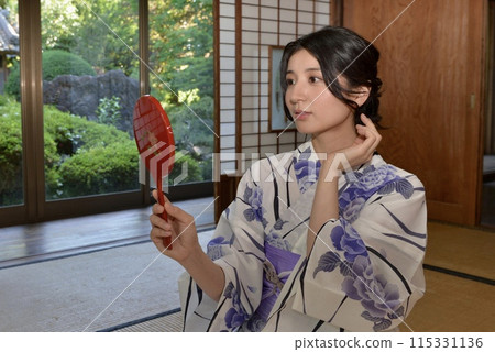Portrait of a young woman wearing a yukata Portrait of a young woman wearing a yukata 115331136