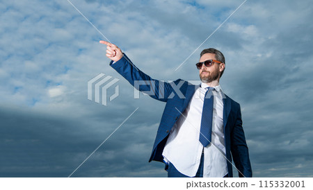 carefree business man in suit outdoor, advertisement. carefree business man in suit. carefree business man in suit outdoor, advertisement. carefree business man in suit. 115332001