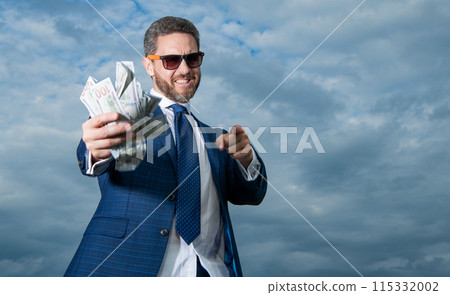 richness photo of man with money, copy space. richness of man with money on sky background. richness photo of man with money, copy space. richness of man with money on sky background. 115332002