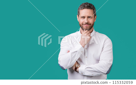 photo of cheerful mature man with stubble. mature man isolated on blue background. photo of cheerful mature man with stubble. mature man isolated on blue background. 115332059