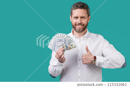 businessman earning money isolated on blue background. businessman earning money 115332061