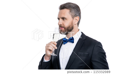 cheers and celebrate. man in tuxedo cheers and celebrate in studio. man in tuxedo to cheers cheers and celebrate. man in tuxedo cheers and celebrate in studio. man in tuxedo to cheers 115332089