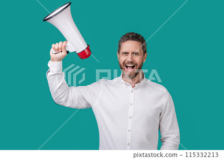 man announce with loudspeaker isolated on blue background. man hold loudspeaker 115332213
