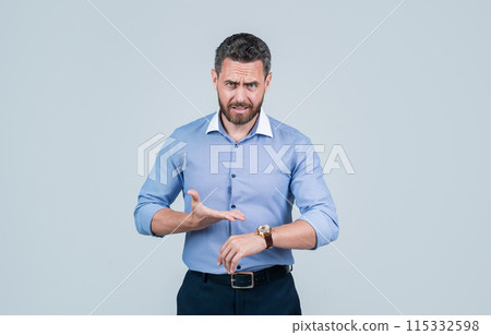 handsome smiling bearded businessman in shirt showing on watch, lack of time 115332598