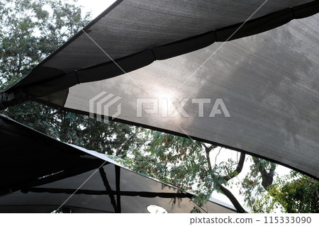 Sun canopy in a city park on the seashore. Sun canopy in a city park on the seashore. 115333090